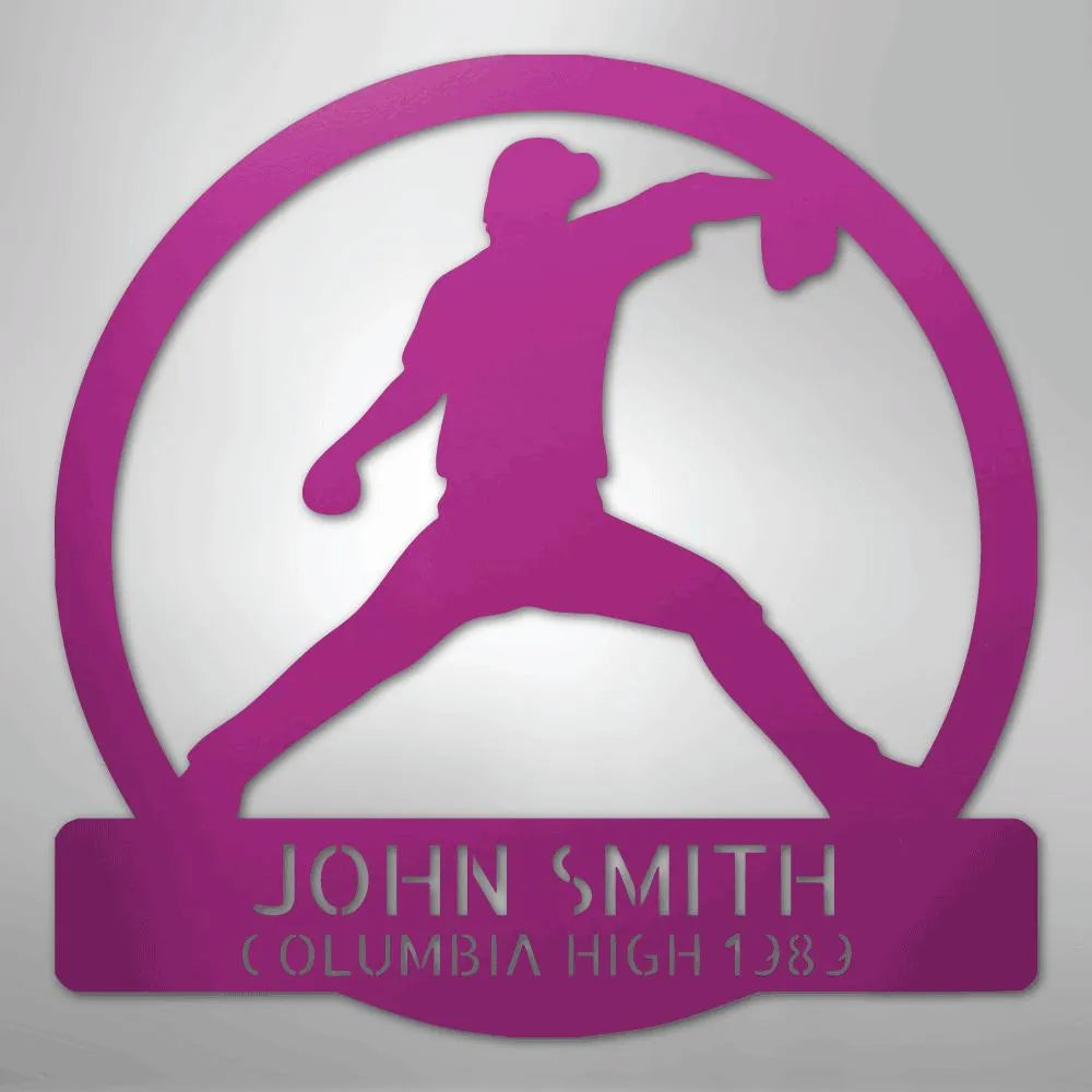 Pink metal wall art featuring a baseball pitcher silhouette within a circle, personalized with "JOHN SMITH" and "COLUMBIA HIGH 1989".