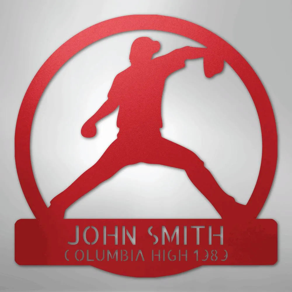 Red metal wall art featuring a baseball pitcher silhouette within a circle, personalized with "JOHN SMITH" and "COLUMBIA HIGH 1989".