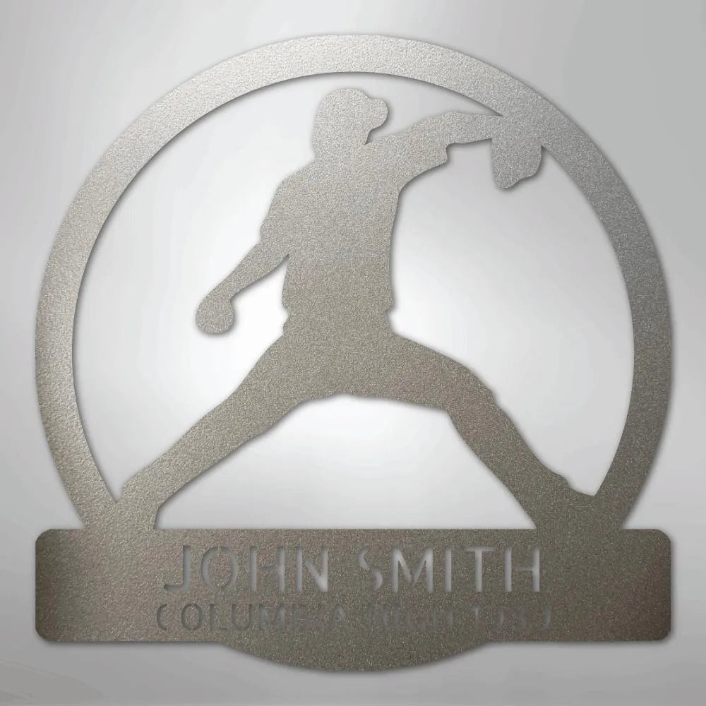 Silver metal wall art with a baseball pitcher silhouette in a circle, personalized with "JOHN SMITH" and "COLUMBIA (TN)".