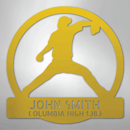Gold metal wall art with a baseball pitcher silhouette inside a circle, personalized with "JOHN SMITH COLUMBIA HIGH 1983".