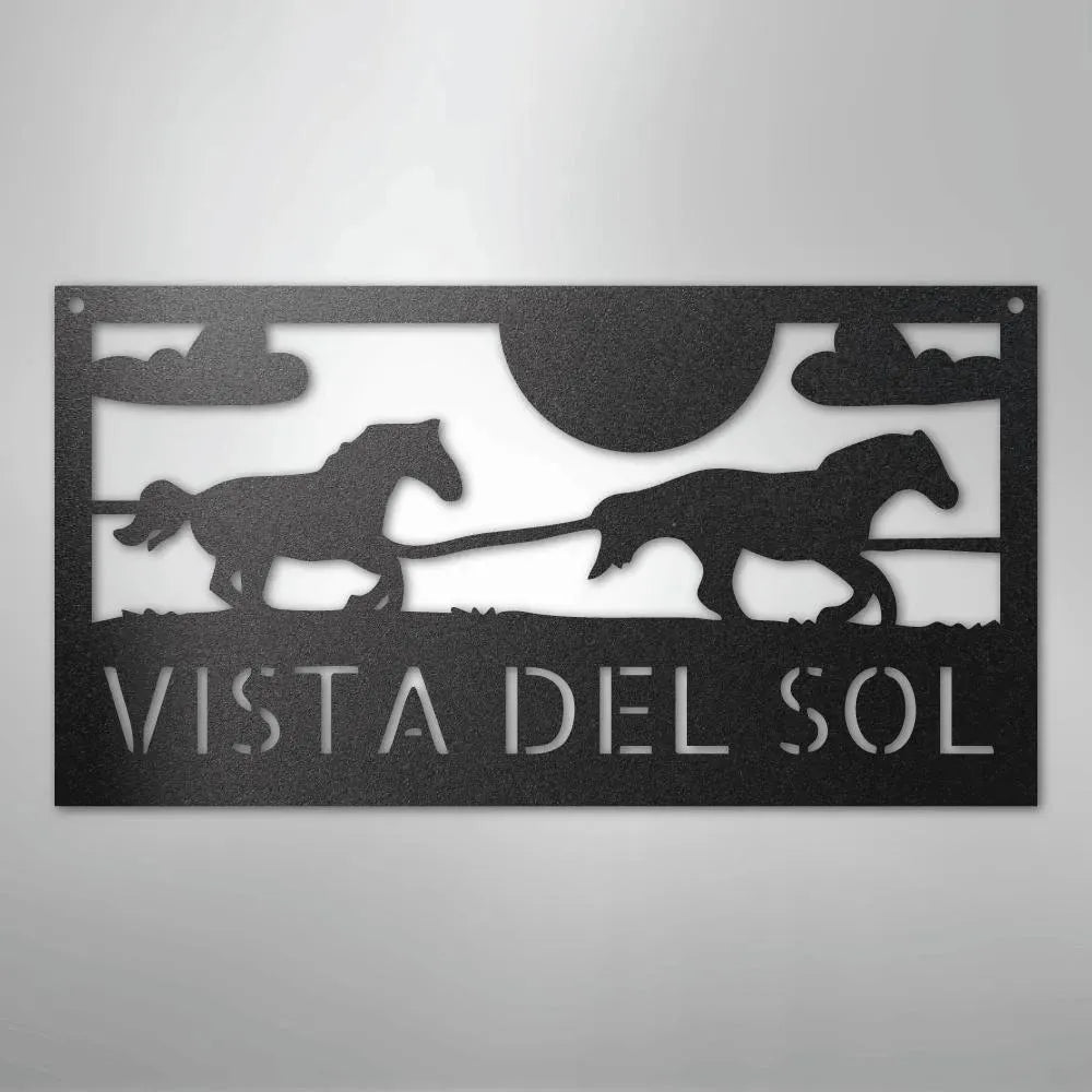Black metal outdoor address sign with two racing horse silhouettes, sun, clouds, and "VISTA DEL SOL" text.