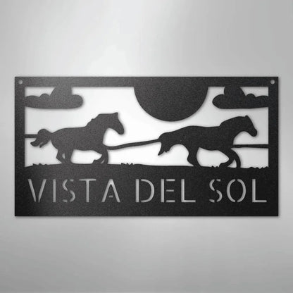 Black metal outdoor address sign with two racing horse silhouettes, sun, clouds, and "VISTA DEL SOL" text.