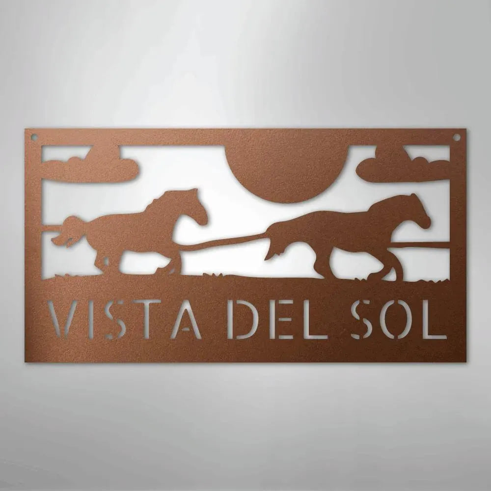 Copper-toned metal sign with two racing horses, sun, clouds, and "VISTA DEL SOL" cutouts.