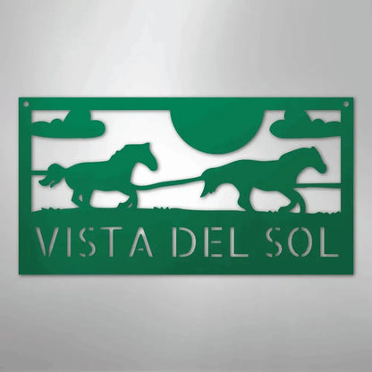 Green metal racing horses monogram sign with "VISTA DEL SOL" text, clouds, and sun cutout.