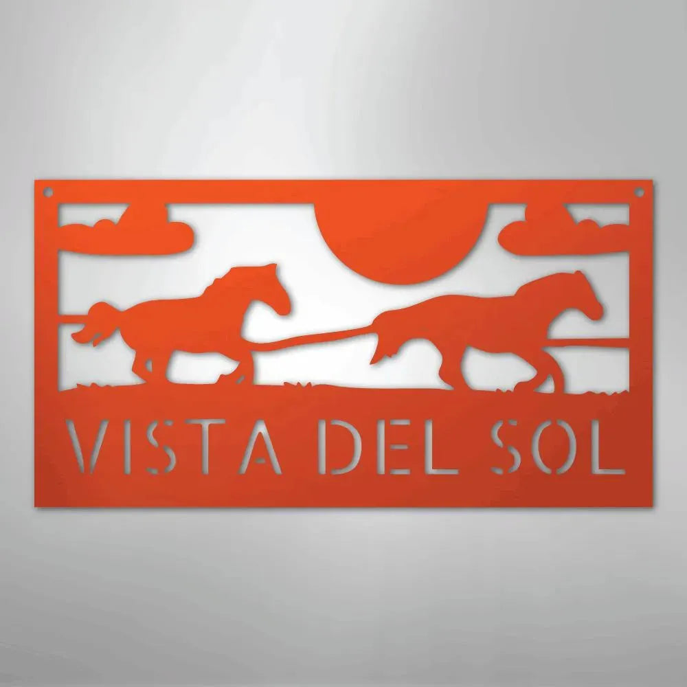 Orange metal sign with two racing horses, sun, clouds, and "VISTA DEL SOL" text.