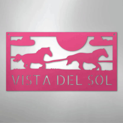 Pink metal sign with racing horse silhouettes, sun, clouds, and "VISTA DEL SOL" text.