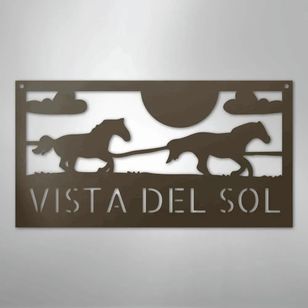 Brown metal address sign with two racing horse silhouettes, sun, clouds, and "VISTA DEL SOL" text.