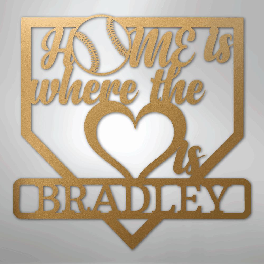 Gold metal baseball home plate sign with "Home is where the heart is Bradley" text and a baseball graphic.