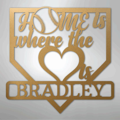 Gold metal baseball home plate sign with "Home is where the heart is Bradley" text and a baseball graphic.