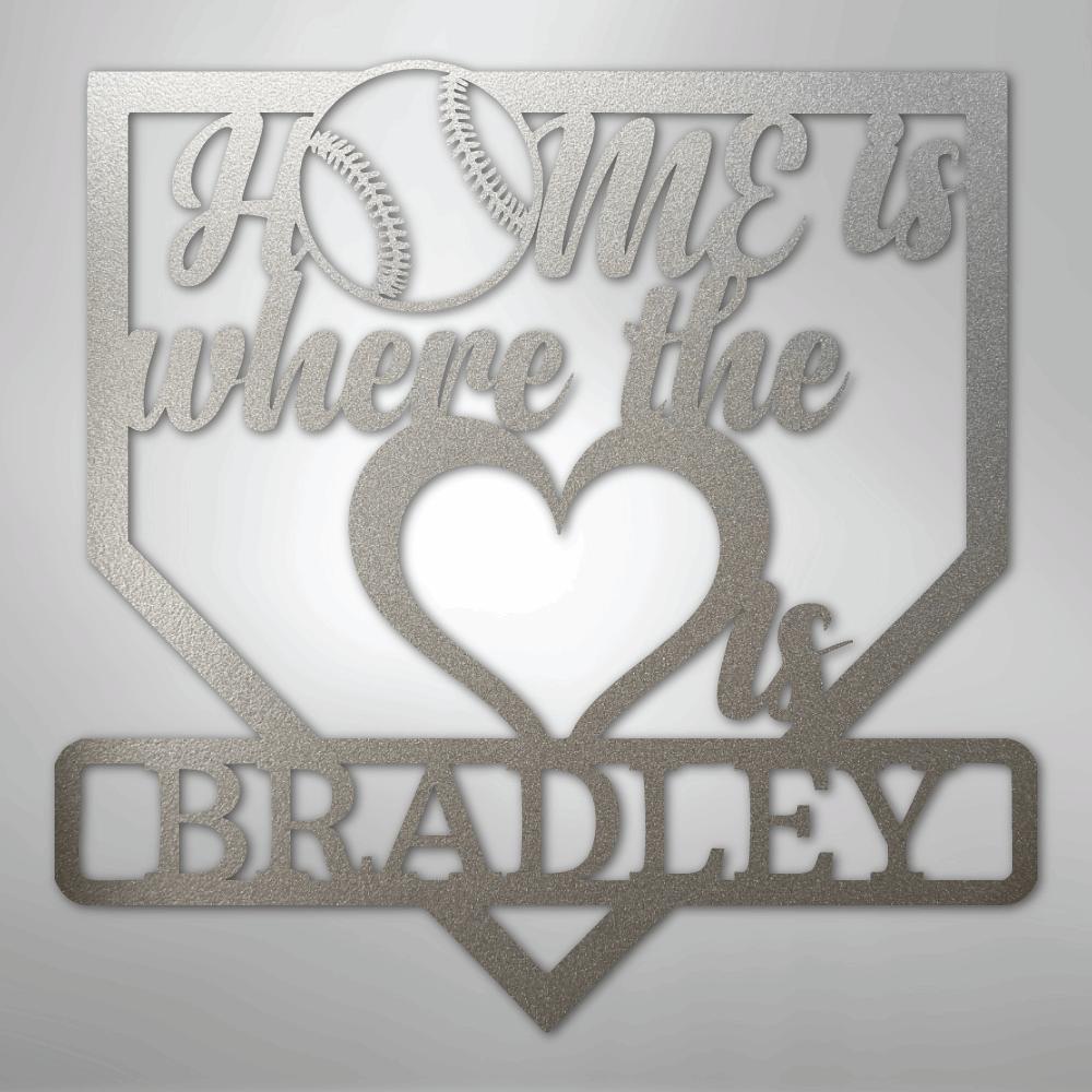 Silver metal baseball home plate sign with "Home is where the heart is Bradley" text and baseball graphic.