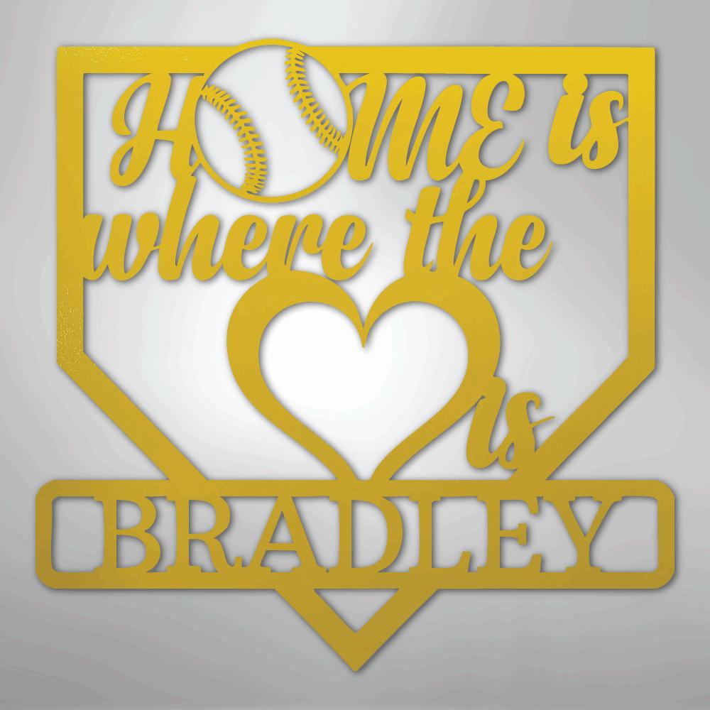 Yellow metal baseball home plate sign with "Home is where the heart is Bradley" text and a baseball graphic.