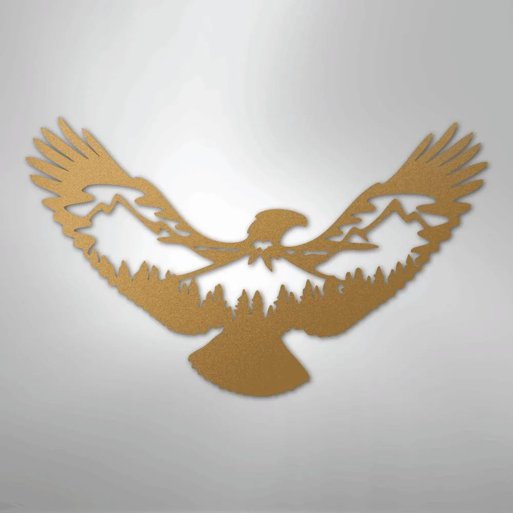 Bronze metal wall art of an eagle with mountains and pine trees cut out of its body.
