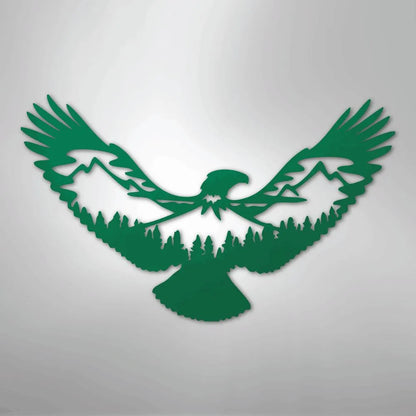 Green metal wall art featuring an eagle silhouette with mountains and pine trees within its wings.
