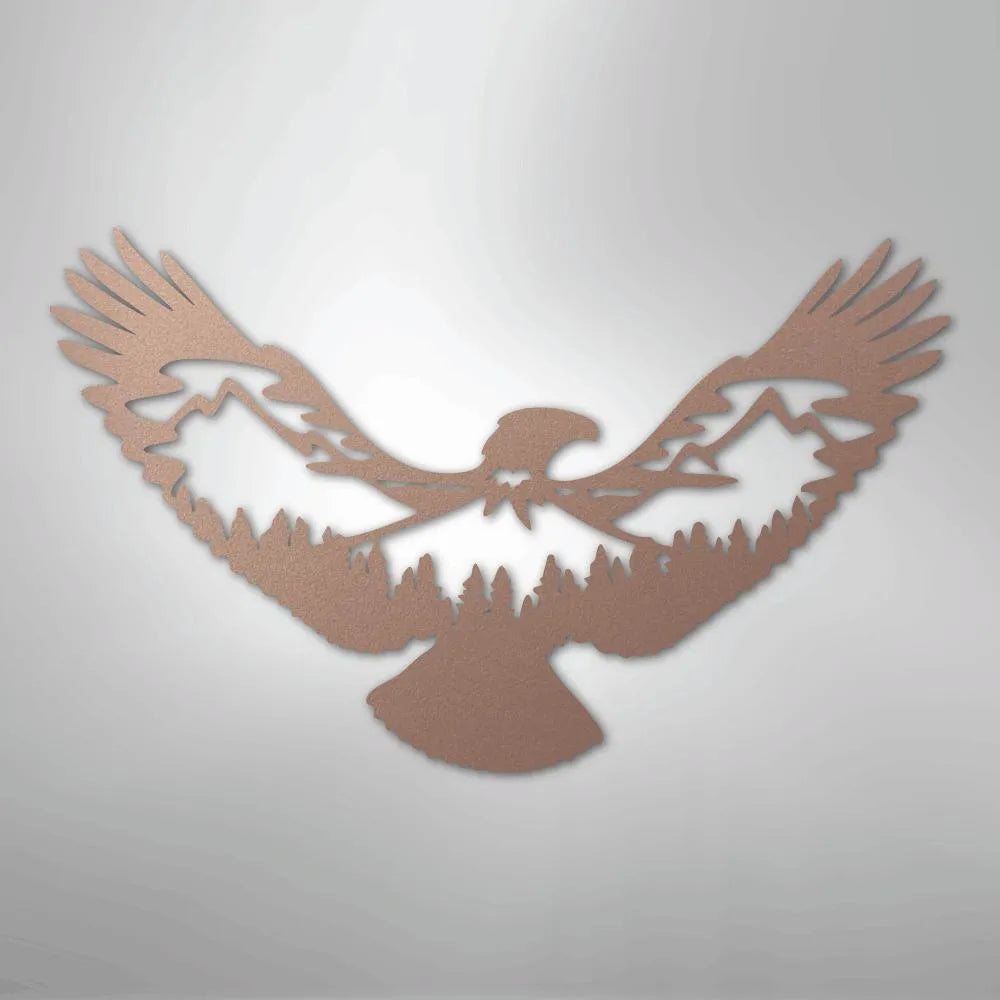 Copper metal wall art of an eagle with mountains and pine trees silhouetted in its wings.