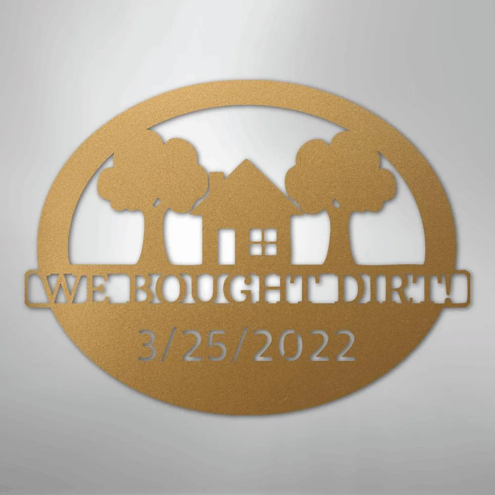 Bronze oval metal wall art with a house, two trees, "WE BOUGHT DIRT", and "3/25/2022" cut out.