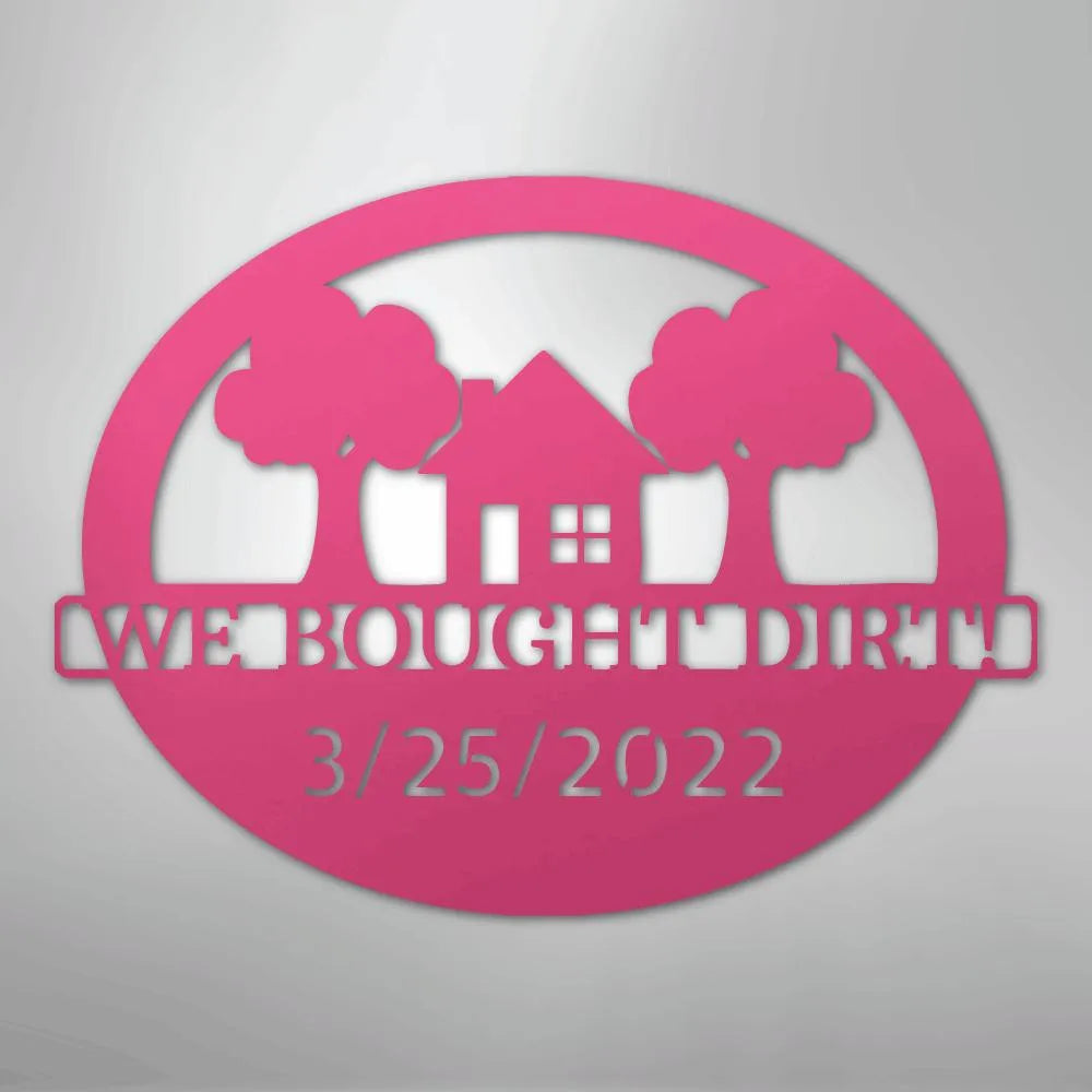 Pink oval metal wall art with "WE BOUGHT DIRT" and "3/25/2022" text, house, and trees.