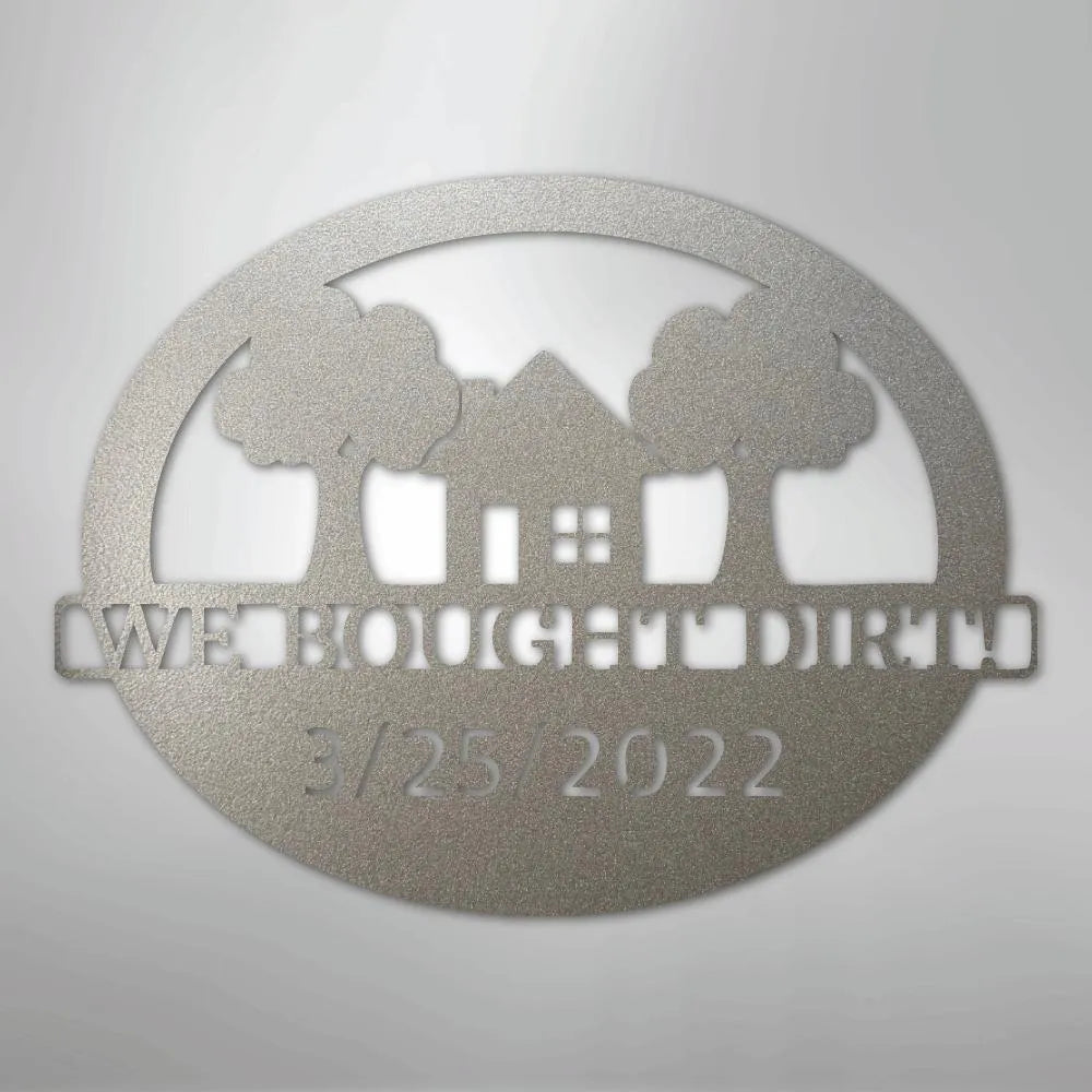 Silver metal wall art with "We Bought Dirt" text, house, trees, and "3/25/2022" date.