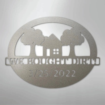 Silver metal wall art with "We Bought Dirt" text, house, trees, and "3/25/2022" date.