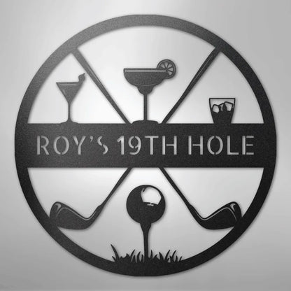 Black metal "ROY'S 19TH HOLE" sign with golf clubs, a golf ball, and three cocktail glasses.