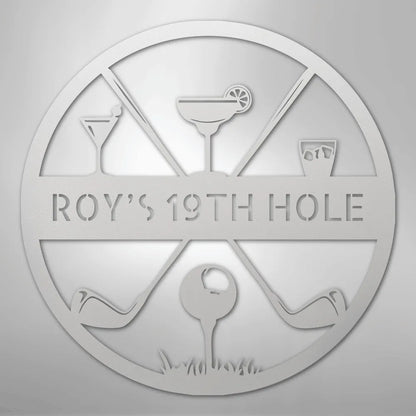 Silver metal "ROY'S 19TH HOLE" monogram sign with golf clubs, ball, and cocktail glasses.
