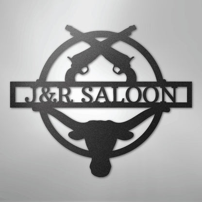 Black metal "J&R SALOON" monogram with crossed pistols and a longhorn skull design.