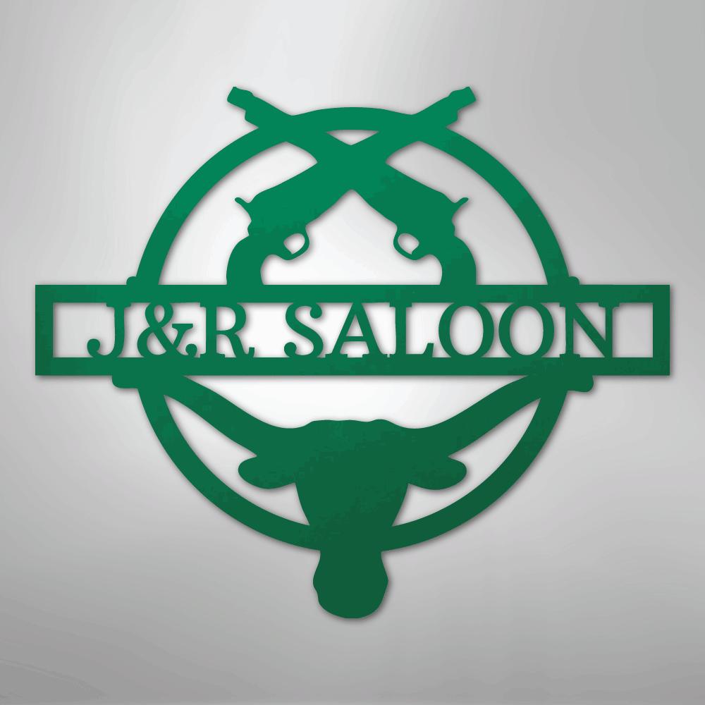 Green metal "J&R Saloon" monogram with crossed pistols and a longhorn skull design.