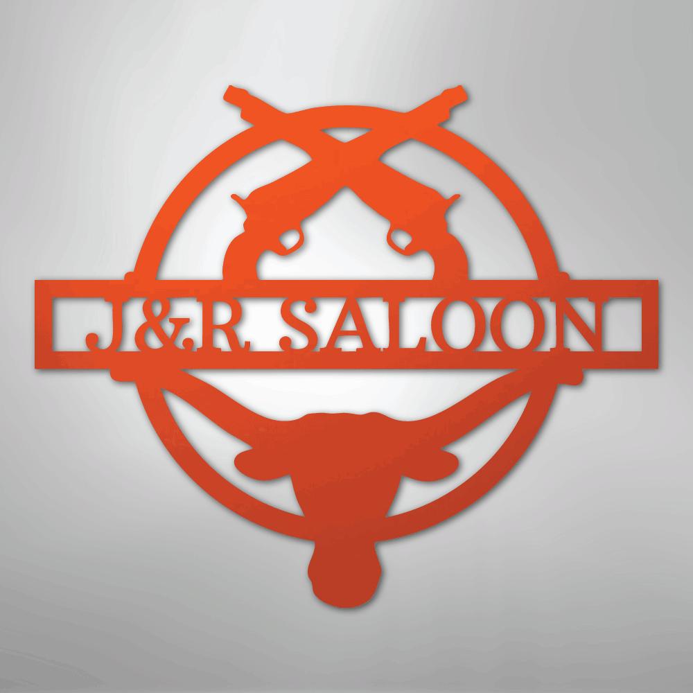 Orange metal "J&R SALOON" monogram with crossed pistols and a longhorn skull design.