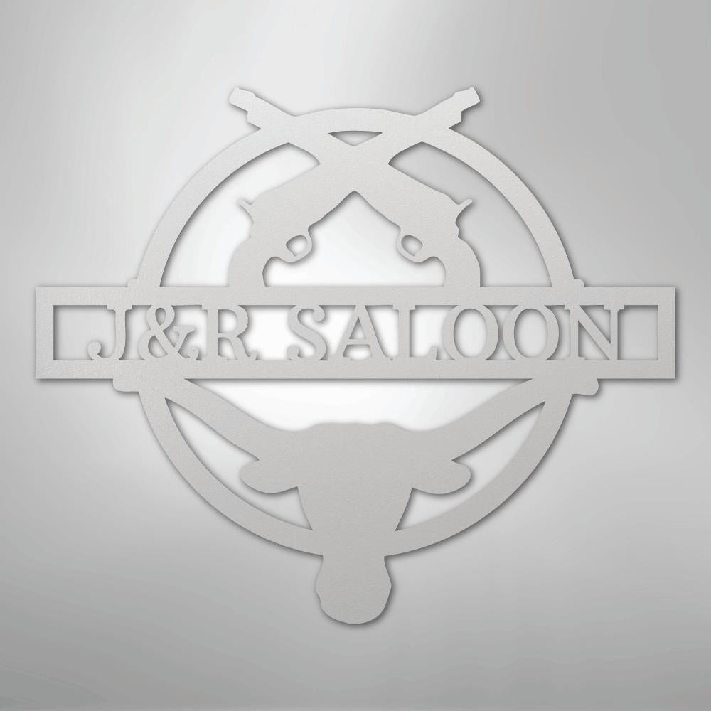 White metal "J&R SALOON" monogram with crossed revolvers and longhorn skull design.