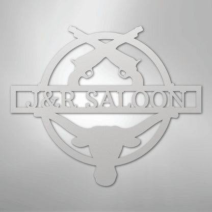 White metal "J&R SALOON" monogram with crossed revolvers and longhorn skull design.