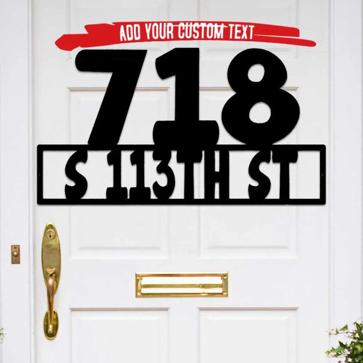 Black metal address sign with large numbers "718" and "S 113TH ST" on a white door.