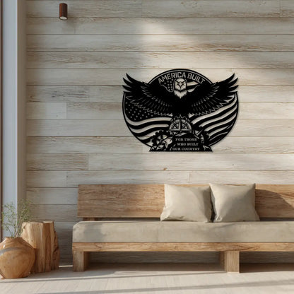 Decorative wall art with an eagle design and 'America Built' text on a wooden wall above a sofa.