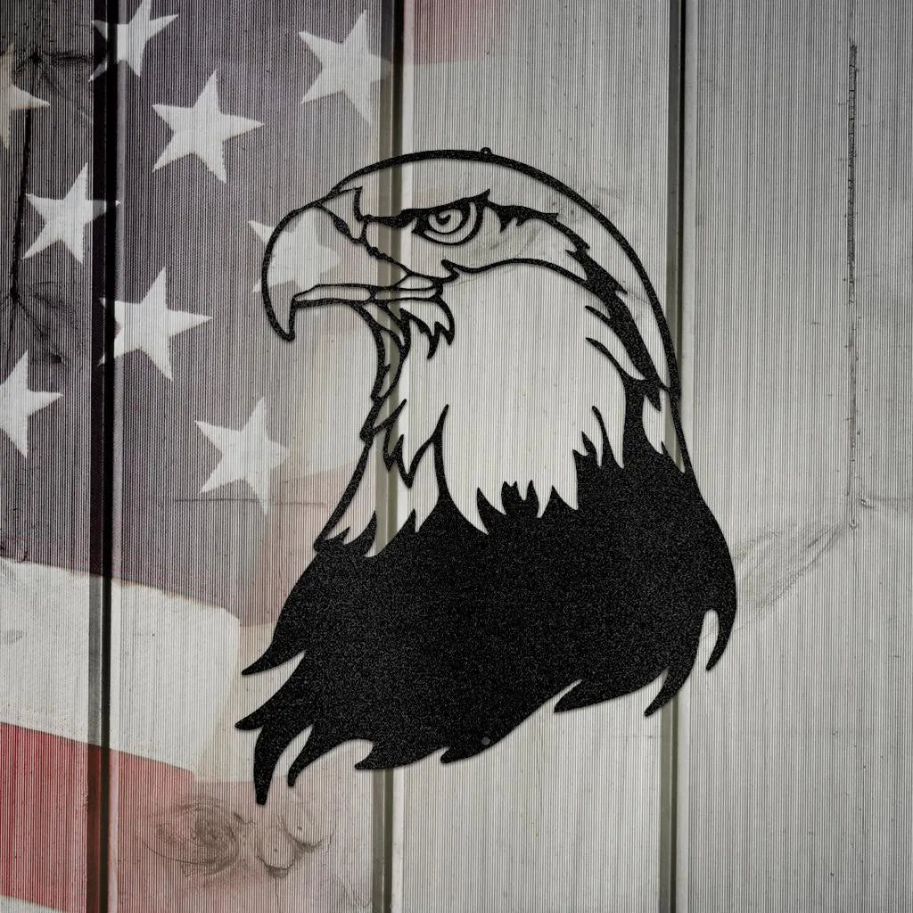 Black metal bald eagle head wall art, detailed silhouette, on a rustic American flag background.
