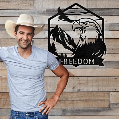 Black metal Bald Eagle Monogram wall art with mountains, trees, and "FREEDOM" text.