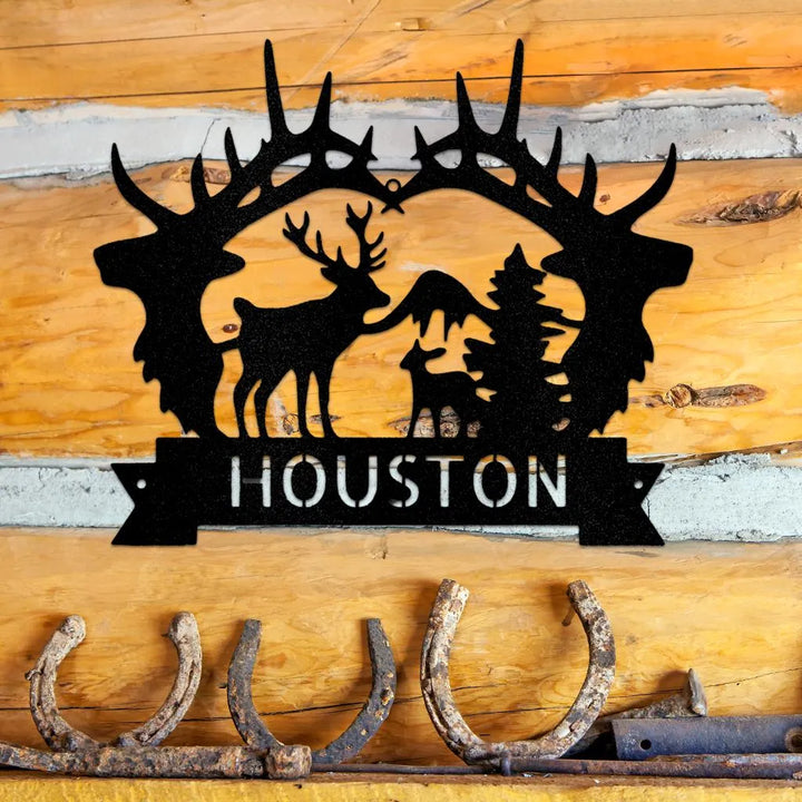 Black powder-coated steel antler monogram with deer, mountains, trees, and "HOUSTON" cut out.