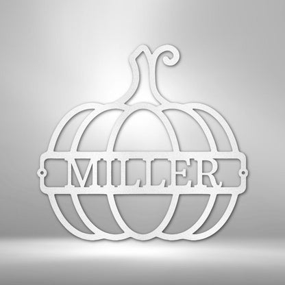 White metal pumpkin wall art with "MILLER" monogram, ideal for fall decor.
