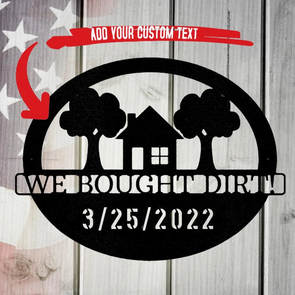 Black metal oval wall art with a house, trees, and "WE BOUGHT DIRT! 3/25/2022" text.