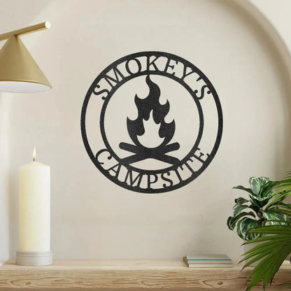 Black metal campfire monogram wall art with "Smokey's Campsite" text and flame design.