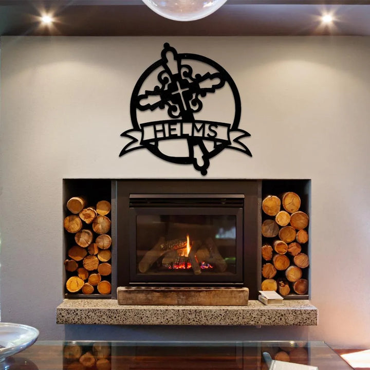 Black metal Catholic monogram wall art with a cross, fleur-de-lis, and "HELMS" banner.