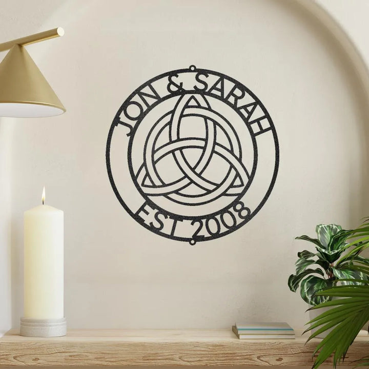 Black metal Celtic Knot Ring Monogram wall art with "Jon & Sarah EST 2008" personalized text.