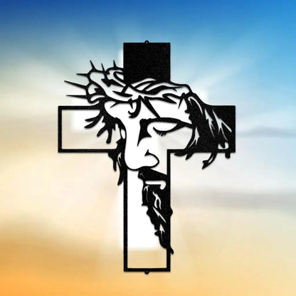 Black metal Christ cross wall art with Jesus's face wearing a crown of thorns.