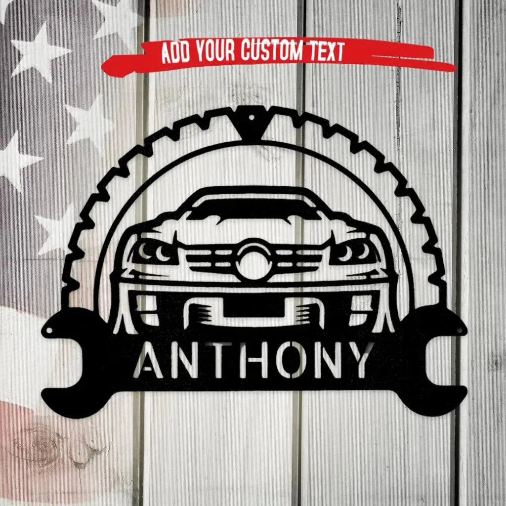 Black metal classic car monogram wall art with tire, wrench, and custom text "ANTHONY" on a rustic flag background.