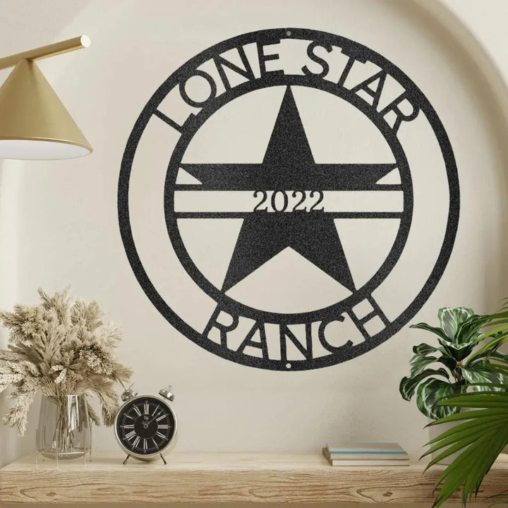 Black metal "Lone Star Ranch 2022" monogram wall art with a star design.