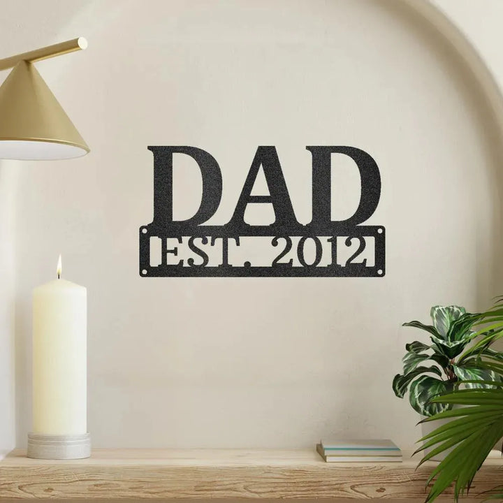Black metal "DAD EST. 2012" wall art, a personalized family decor piece.