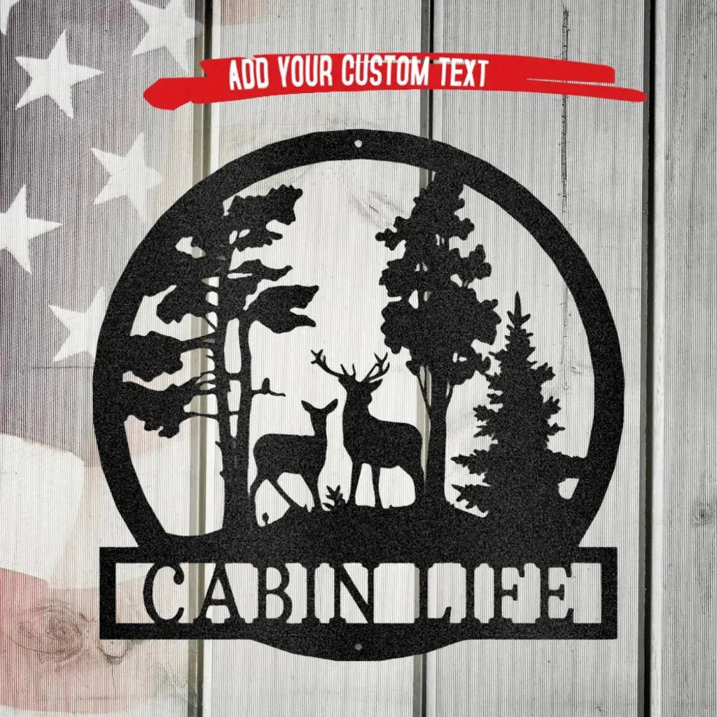 Black metal wall art featuring a deer and doe in a forest, with "CABIN LIFE" text below.
