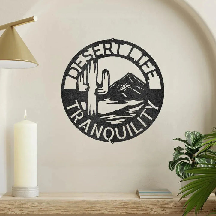 Black metal "Desert Life Tranquility" wall art with saguaro cactus and mountains.