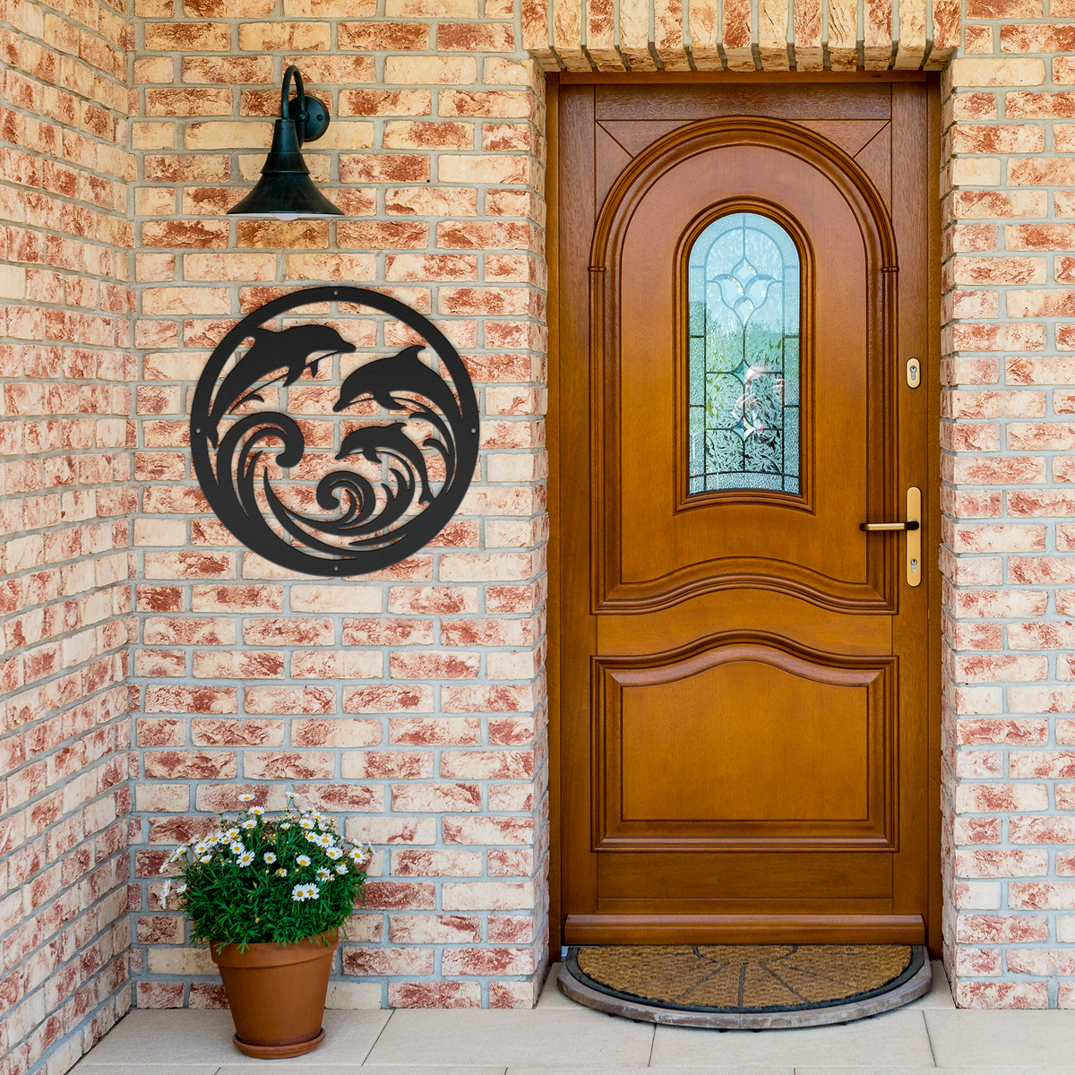 Dolphin_Trio_Round_Metal_Wall_Art_Black_Brick_Entrance_Mockup.png