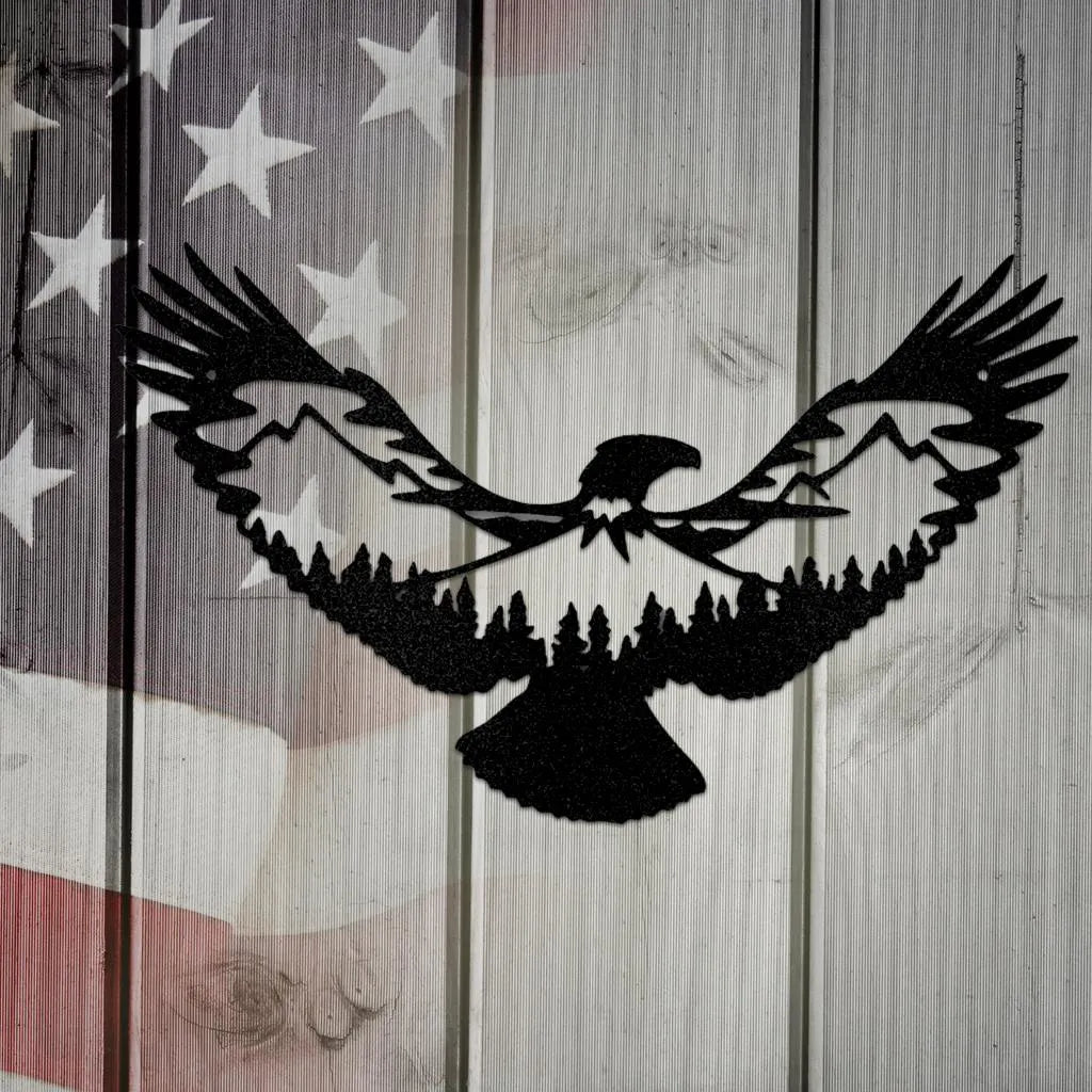 Black metal eagle wall art with mountain and forest silhouette design, set against a rustic American flag.