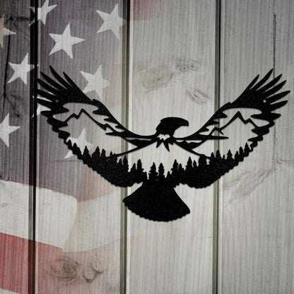 Black metal eagle wall art with mountain and forest silhouette design, set against a rustic American flag.