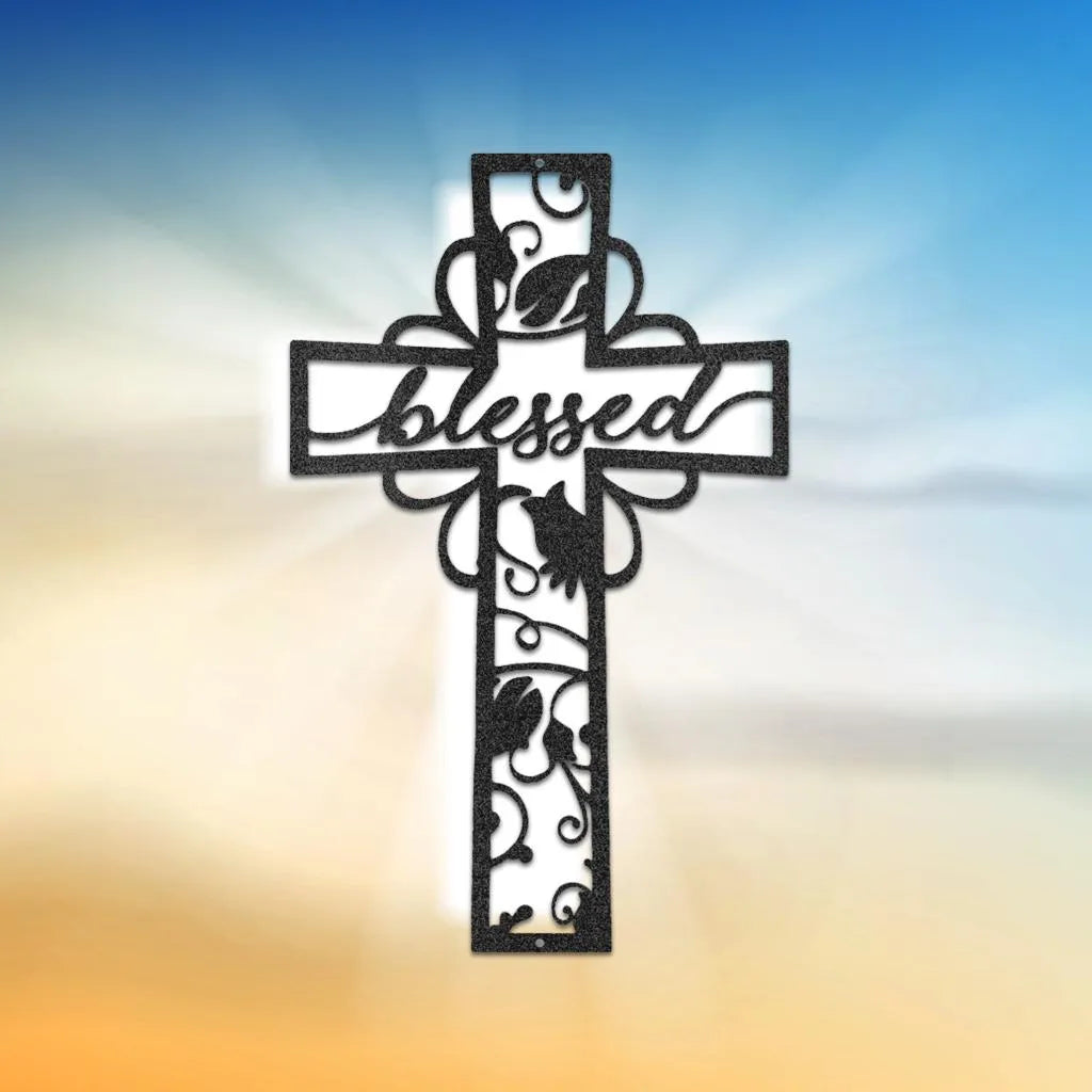 Black metal cross wall art with "blessed" script and intricate vine cutouts.