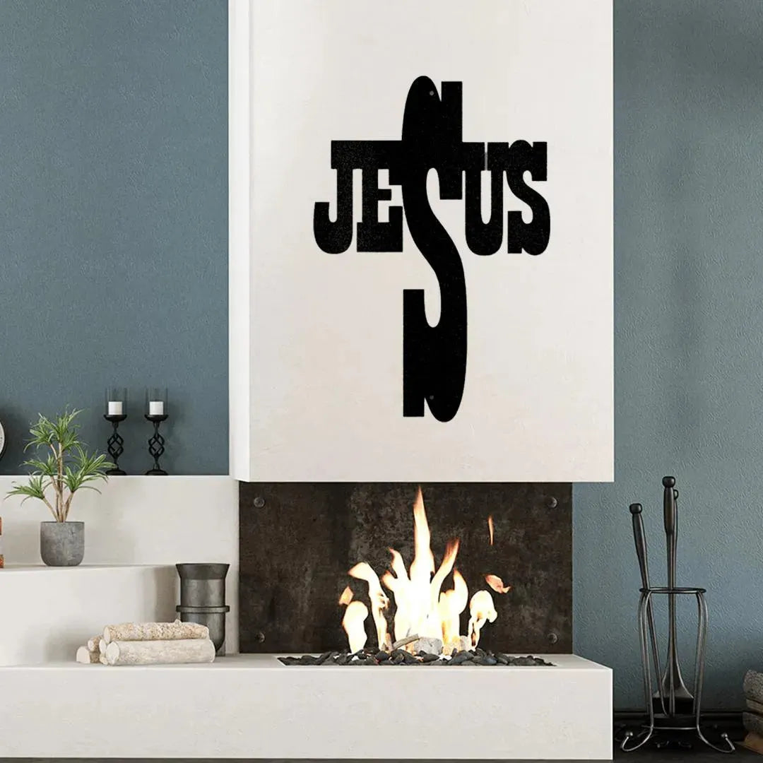 Black metal "JESUS" word art cross above a modern fireplace.